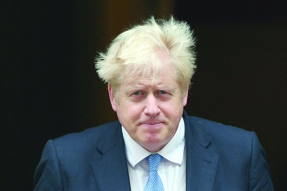 Britain's Prime Minister Boris Johnson outside 10 Downing street in London. - AFP