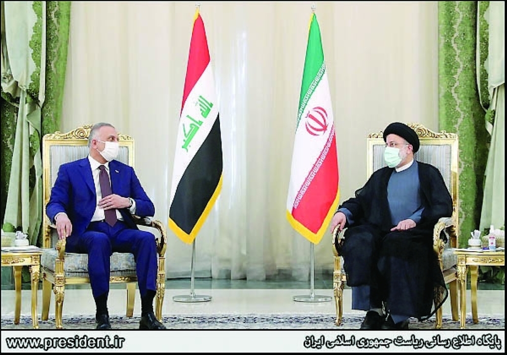 Iran's President Ebrahim Raisi meets Iraq's Prime Minister Mustafa al Kadhimi in Tehran on Sunday. - Reuters