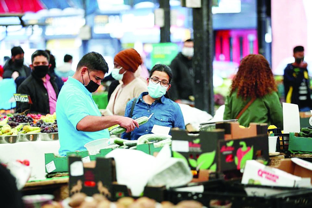 People shop at Leicester Market, amid the spread of the coronavirus disease in Leicester. - Reuters 