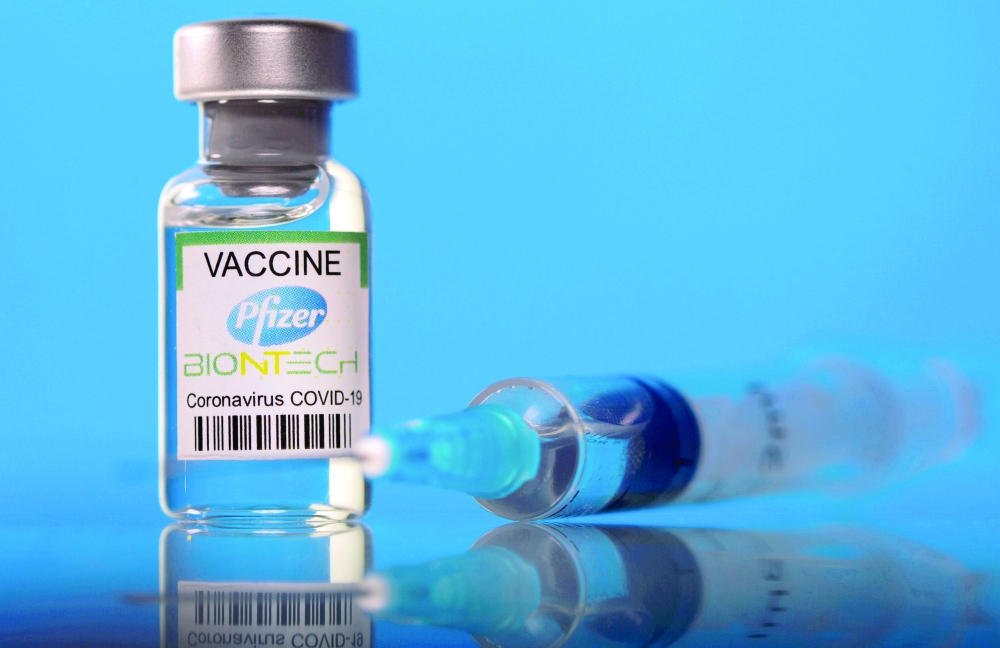 A vial labelled with the Pfizer-BioNTech Covid-19 vaccine is seen in this illustration picture. - Reuters 