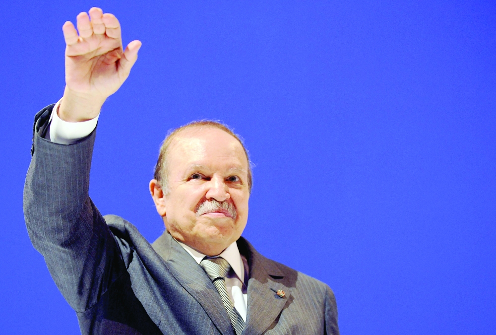 (FILES) In this file photo taken on April 6, 2009 Algerian President Abdelaziz Bouteflika waves to his supporters during his last election meeting in Algiers. Algeria's former president Abdelaziz Bouteflika died on September 17, 2021 aged 84, public television announced, citing a statement from the presidency. (Photo by Pascal GUYOT / AFP)
