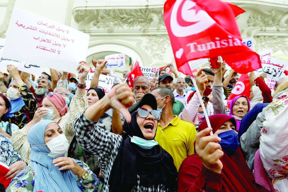 Opponents of Tunisia's President Kais Saied take part in a protest in Tunis. -- Reuters
