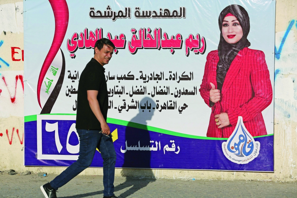 A campaign poster is seen in Baghdad ahead of the upcoming parliamentary elections. - AFP