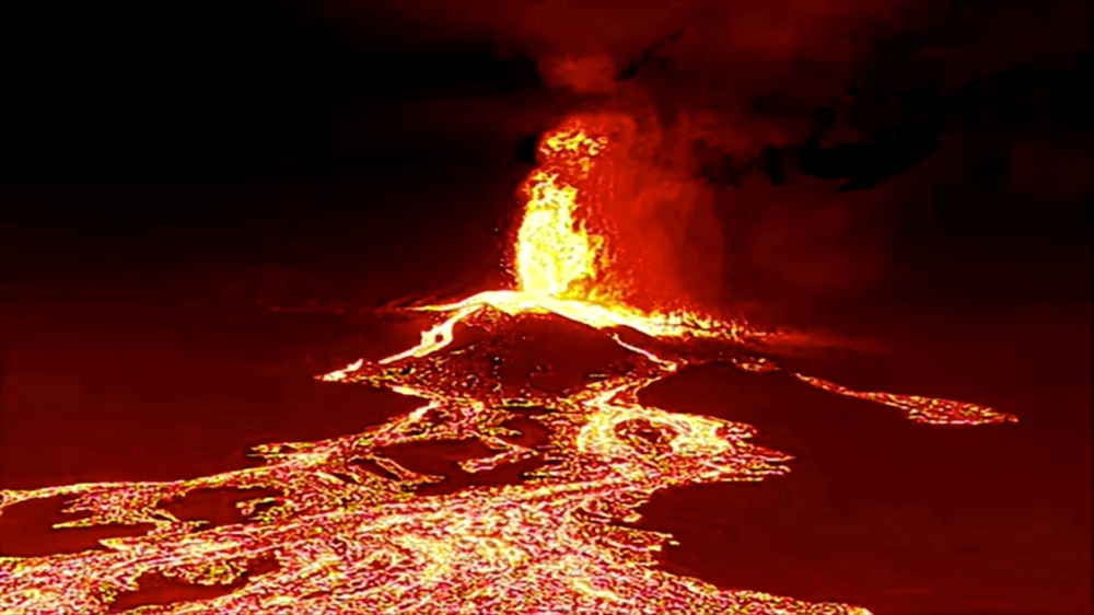 Night drone shot of Volcano erupting and tongues of lava in La Palma