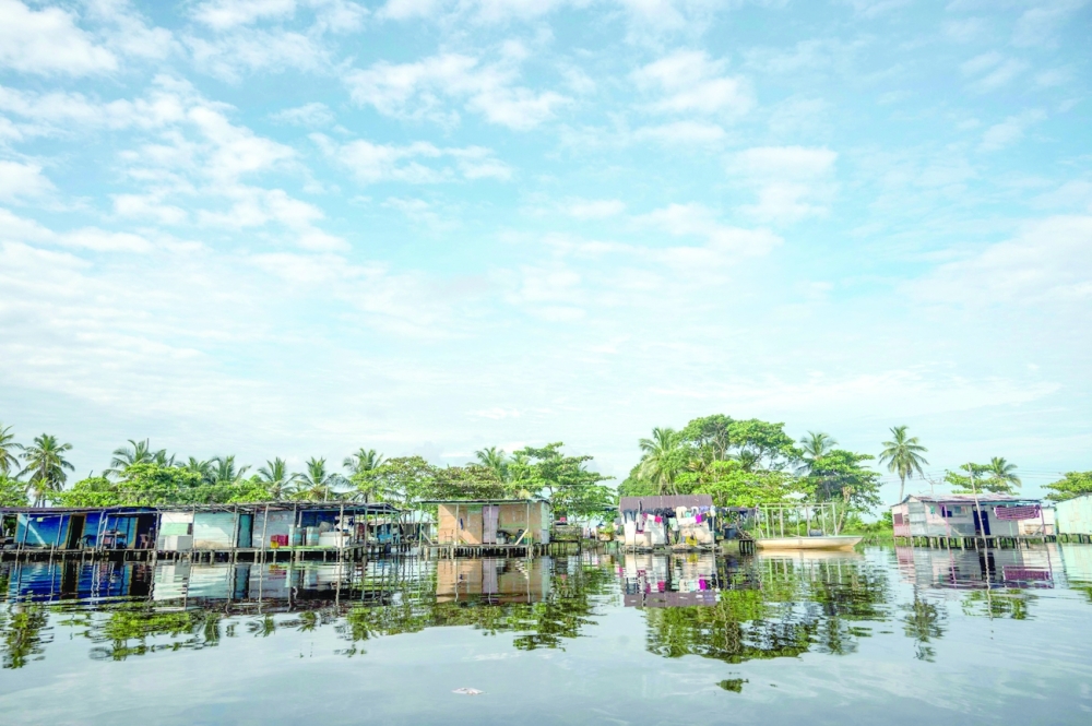 View of stilt houses over lake Maracaibo in the village of Ologa. -- AFP