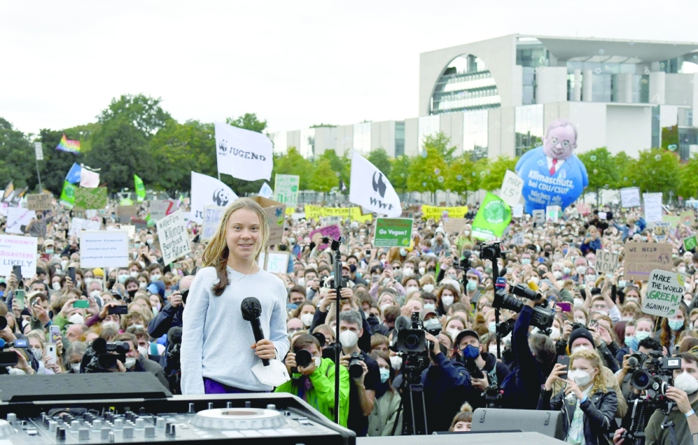 Swedish climate activist Greta Thunberg speaks to demonstrators taking part in a Fridays for Future global climate strike in Berlin on Friday, two days ahead of the German federal election. -- AFP