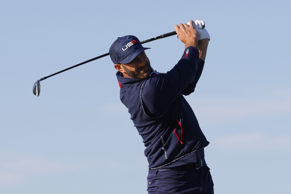 Team USA's Dustin Johnson hits his tee shot on the 6th hole during the Foursomes. -- Reuters