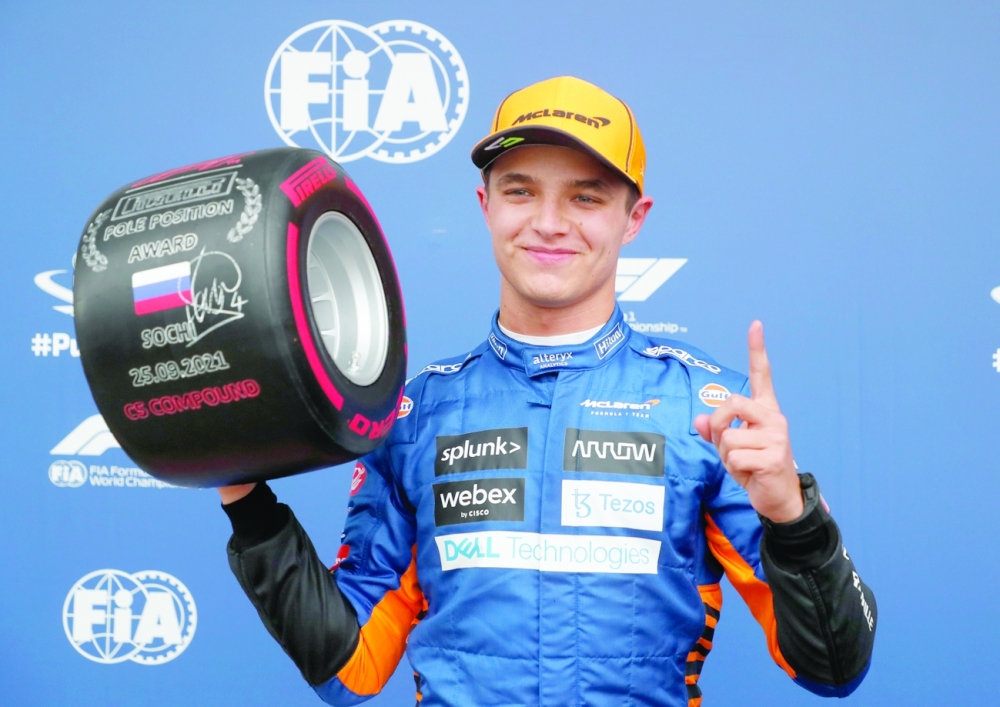 McLaren's Lando Norris celebrates pole position after qualifying. -- Reuters