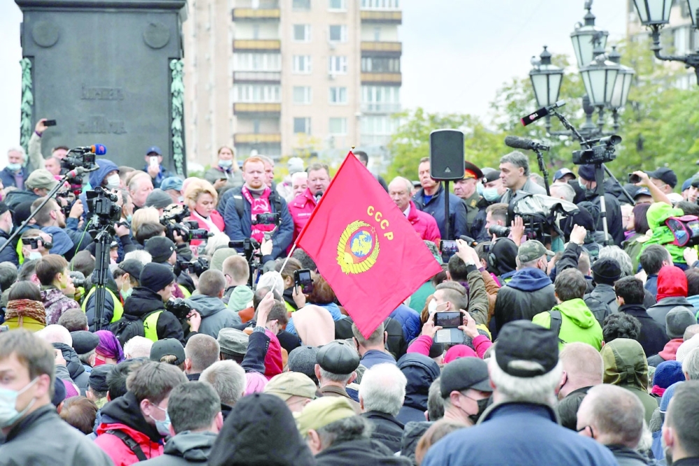 People attend a Russian Communist Party rally against the results of the parliamentary election at Moscow's Pushkinskaya Square on Saturday. -- AFP
