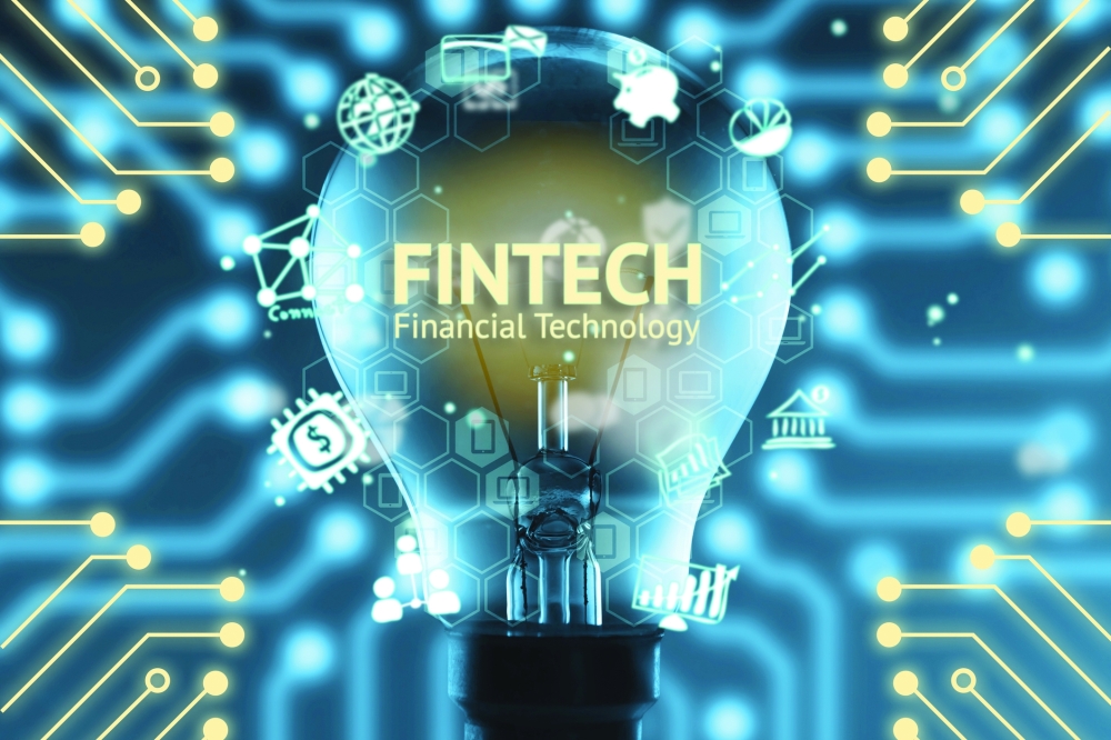 Fintech concept . Icons of financial technology and bank . Light bulb , Infographic , texts and icons. Electric circuits graphic with blue background