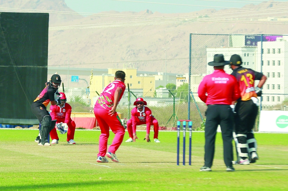 Oman captain Zeeshan Maqsood bowls against PNG at OCA Ground 2 in Al Amerat on Sunday.