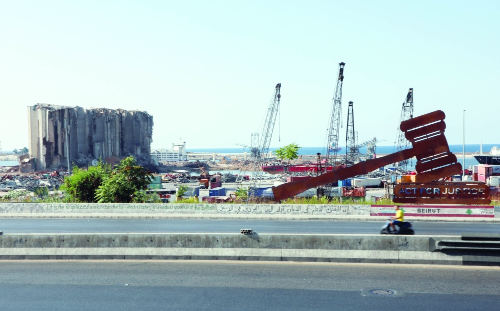 A person rides a motorbike near the site of the 2020 port blast in Beirut, Lebanon, on Monday. — Reuters