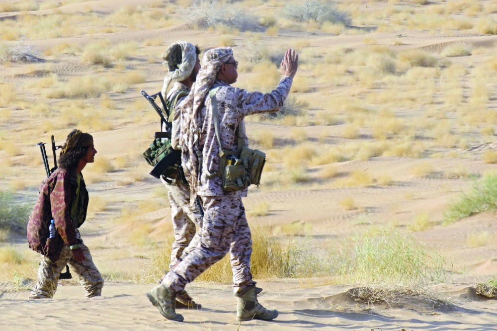 Fighters loyal to government are pictured on the frontline facing Ansar Allah fighters in the country's northeastern province of Marib on Monday. - AFP