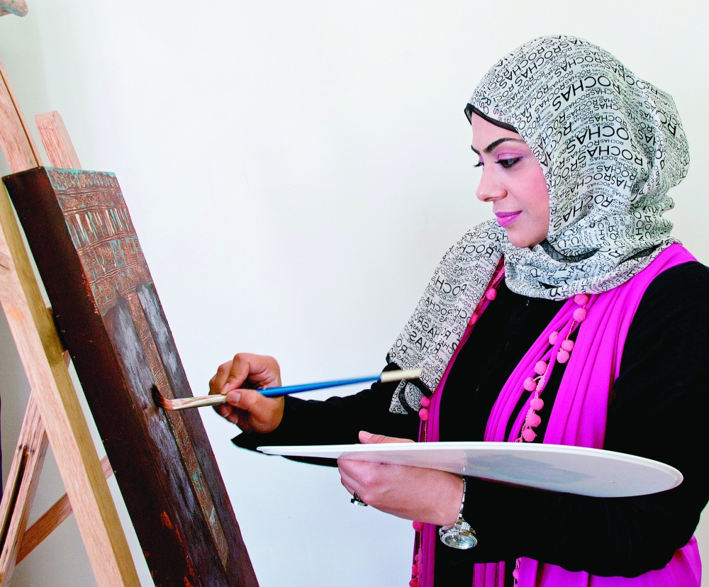 Artist Enaam Ahmed at work.