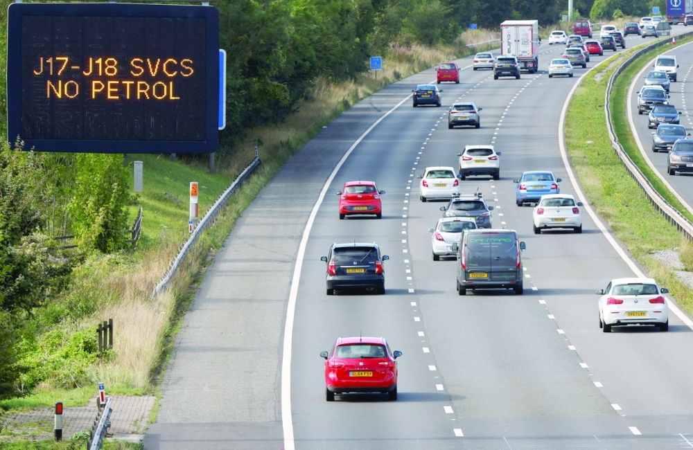A gantry sign on the M4 motorway informs drivers that the motorway services between junctions 17 and 18 have no petrol, near Hungerford. -- Reuters
