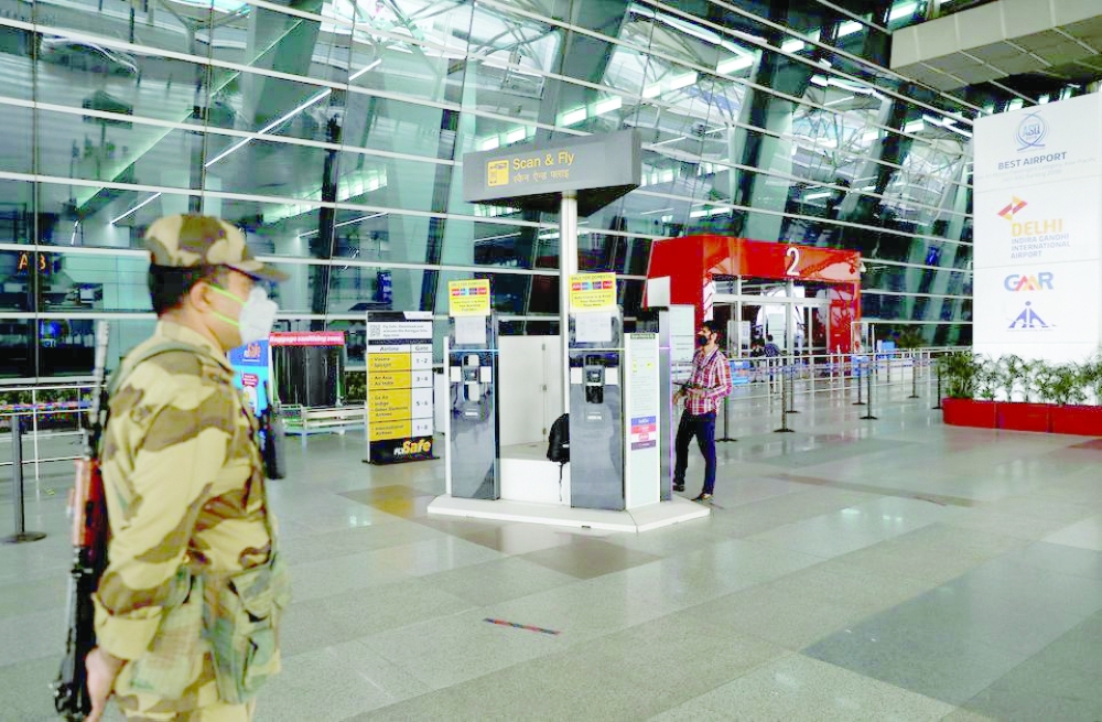 A man checks the Scan & Fly kiosks at the Indira Gandhi International Airport in New Delhi. -- Reuters
