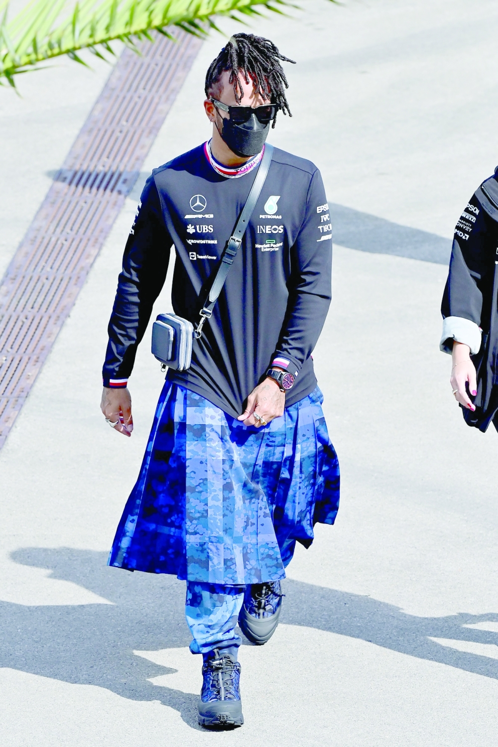 Mercedes' British driver Lewis Hamilton walks down the paddock of the Intercity Istanbul Park in Istanbul on October 7, 2021.  The Formula One Grand Prix of Turkey will take place on October 10, 2021 at Intercity Istanbul Park. (Photo by Andrej ISAKOVIC / AFP)

