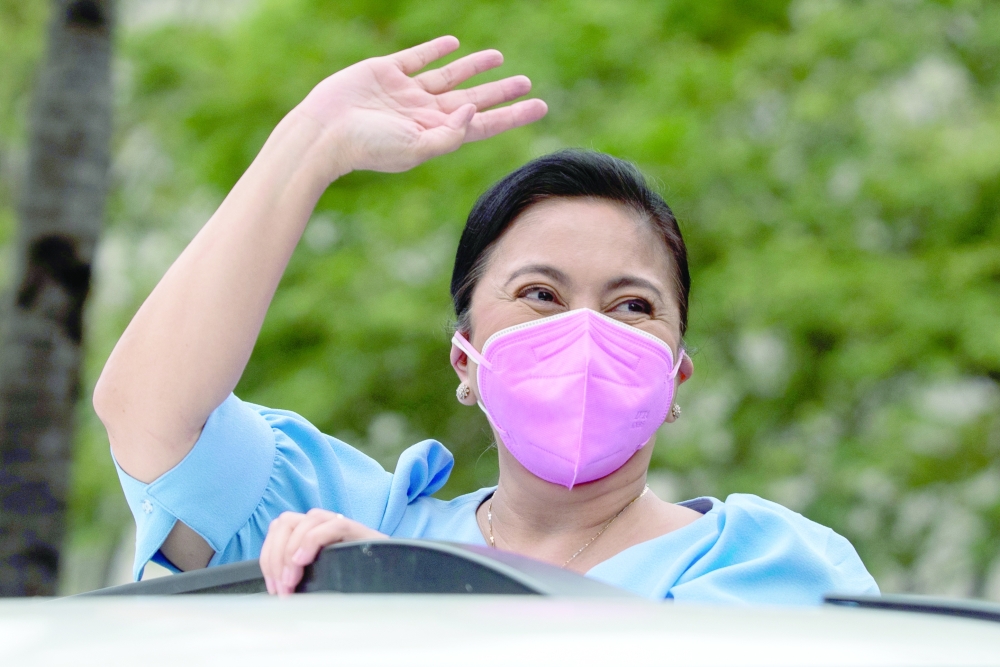 Philippine Vice President Leni Robredo gestures after filing her certificate of candidacy for president in the 2022 national election. -- Reuters
