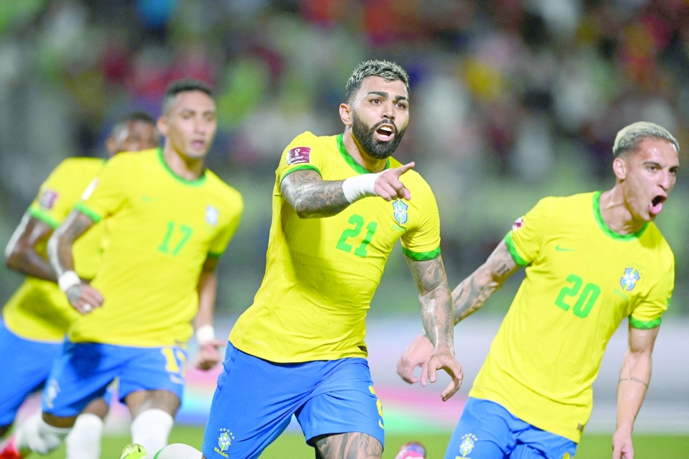 Brazil's Gabriel Barbosa (C) celebrates after scoring against Venezuela during the South American qualification for the FIFA World Cup Qatar 2022. -- AFP