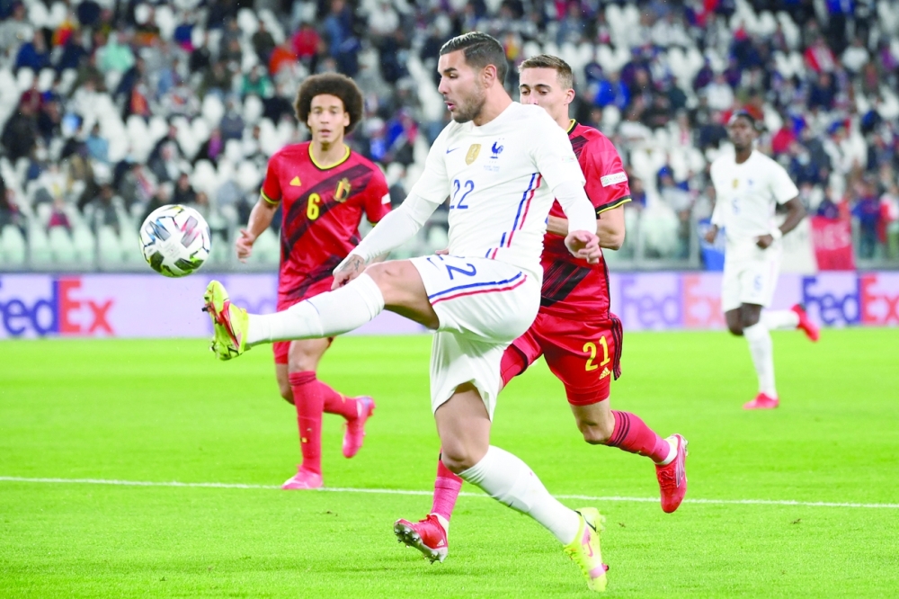 France's defender Theo Hernandez controls the ball during the UEFA Nations League semifinal match against Belgium in Turin. -- AFP

