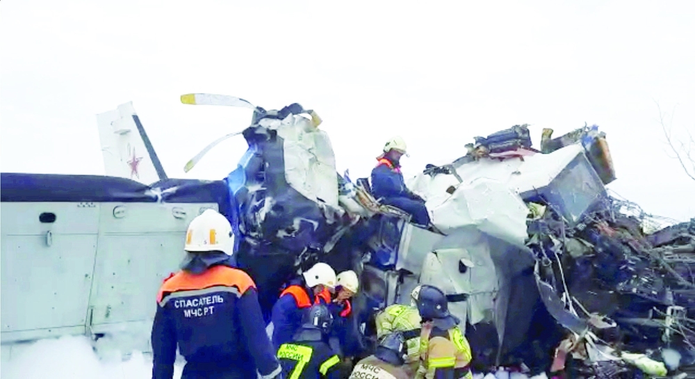 Emergency specialists work at the crash site of the L-410 plane near the town of Menzelinsk in the Republic of Tatarstan, Russia. - Reuters