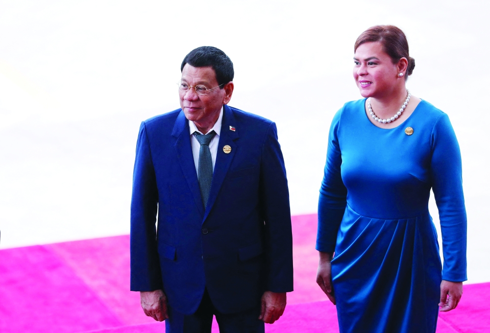 A file photo shows Philippine President Rodrigo Duterte and his daughter Sara Duterte.