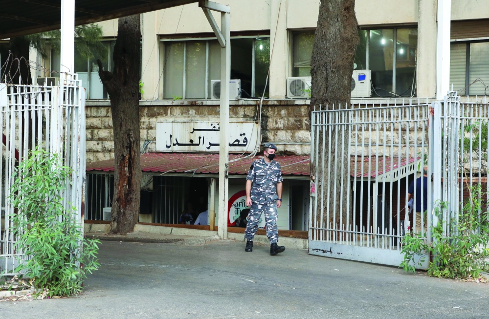 A police member stands outside the Justice Palace, in Beirut, Lebanon, on Tuesday. - Reuters