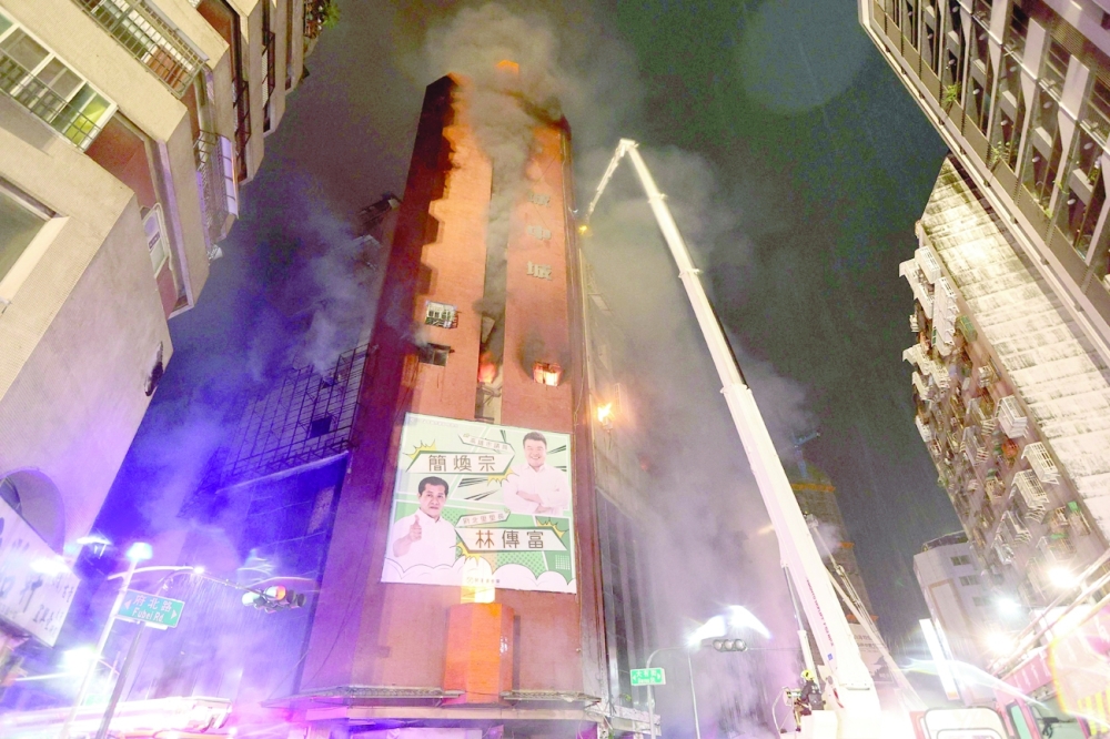 The blaze broke out in the 13-storey, mixed-use building in the small hours of Thursday morning. -- AFP