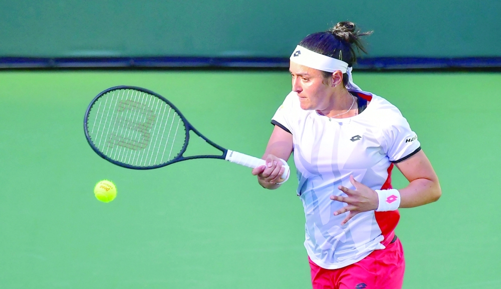 Ons Jabeur of Tunisia hits a forehand reply to Anett Kontaveit of Estonia in their quarterfinal match at the Indian Wells. -- AFP