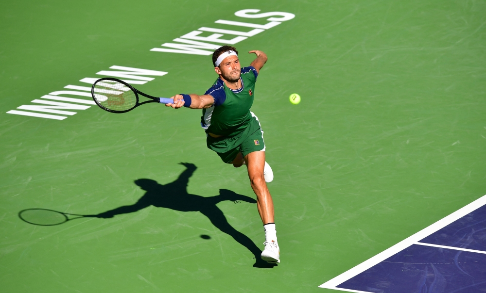 Grigor Dimitrov of Bulgaria reaches for a forehand reply to Hubert Hurkacz of Poland during their quarterfinal men's singles match at the Indian Wells tournament in Indian Wells. -- AFP

