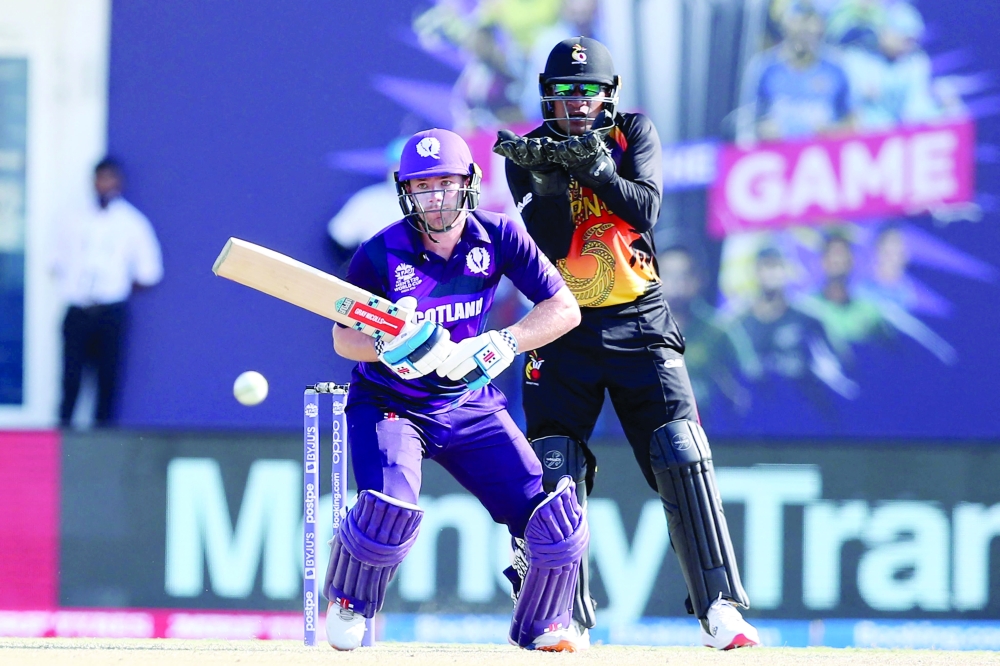 Scotland's Richie Berrington plays a shot during the ICC men痴 Twenty20 World Cup cricket match between Scotland and Papua New Guinea at the Oman Cricket Academy Ground in Muscat on October 19, 2021. (Photo by Haitham AL-SHUKAIRI / AFP)

