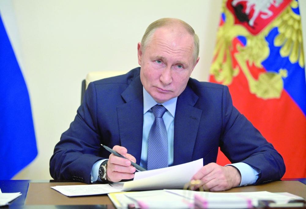 Russian President Vladimir Putin chairs a meeting with members of the government via a teleconference call at the Novo-Ogaryovo state residence outside Moscow. - AFP