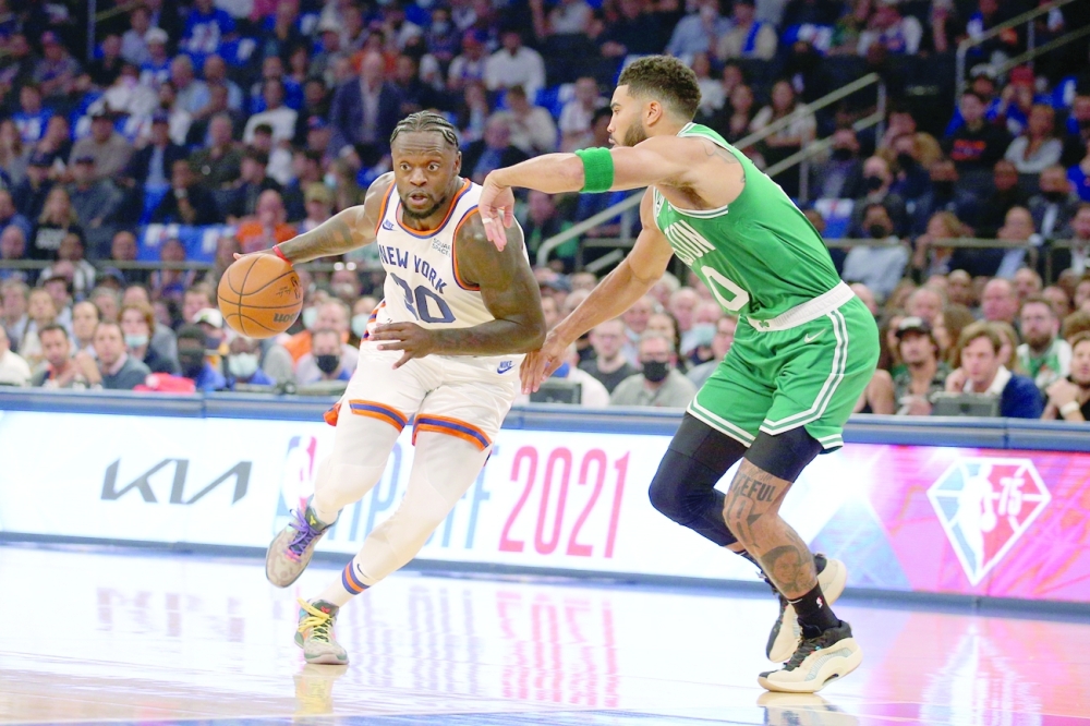 Oct 20, 2021; New York, New York, USA; New York Knicks forward Julius Randle (30) drives to the basket against Boston Celtics forward Jayson Tatum (0) during the first quarter at Madison Square Garden. Mandatory Credit: Brad Penner-USA TODAY Sports
