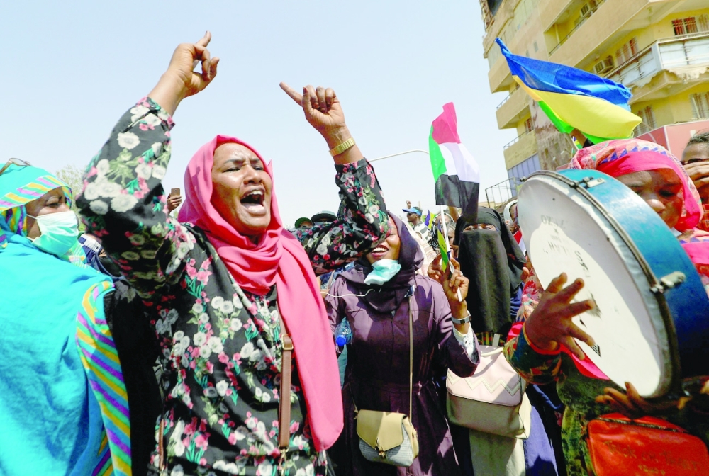 Sudanese demonstrators take to the streets of the capital Khartoum to demand the government's transition to civilian rule, on Thursday. - AFP 