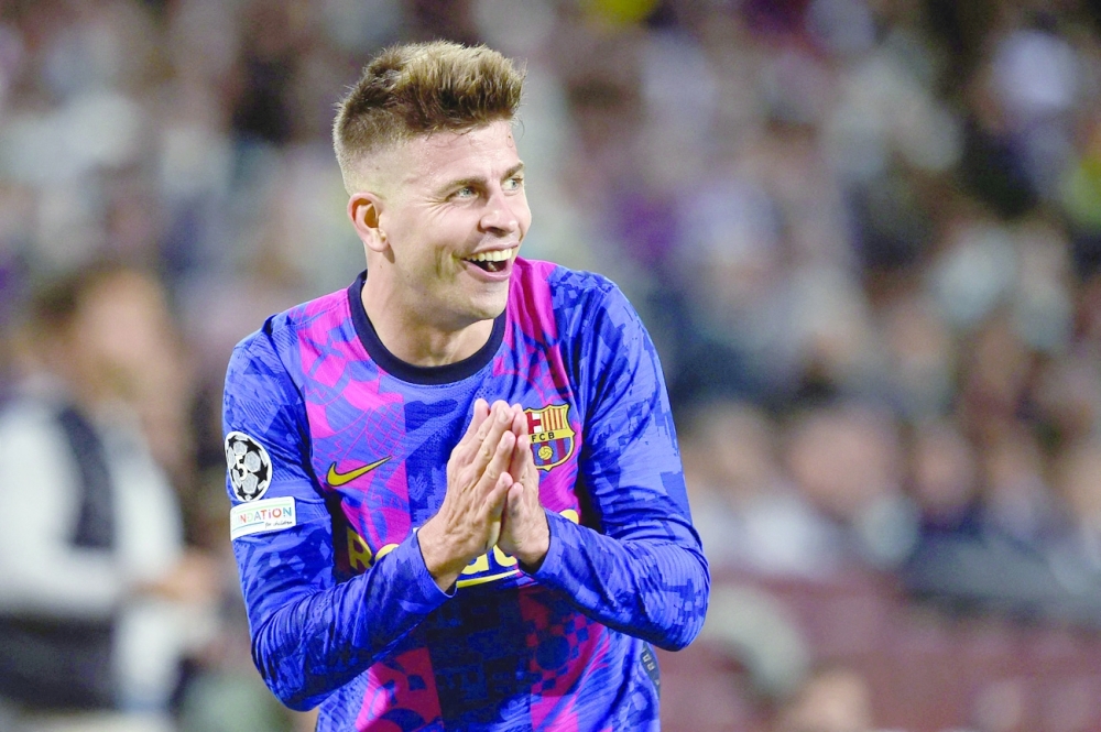 (FILES) In this file photo taken on October 20, 2021 Barcelona's Spanish defender Gerard Pique reacts during the UEFA Champions League Group E between FC Barcelona and Dynamo Kiev at the Camp Nou stadium in Barcelona. -- AFP