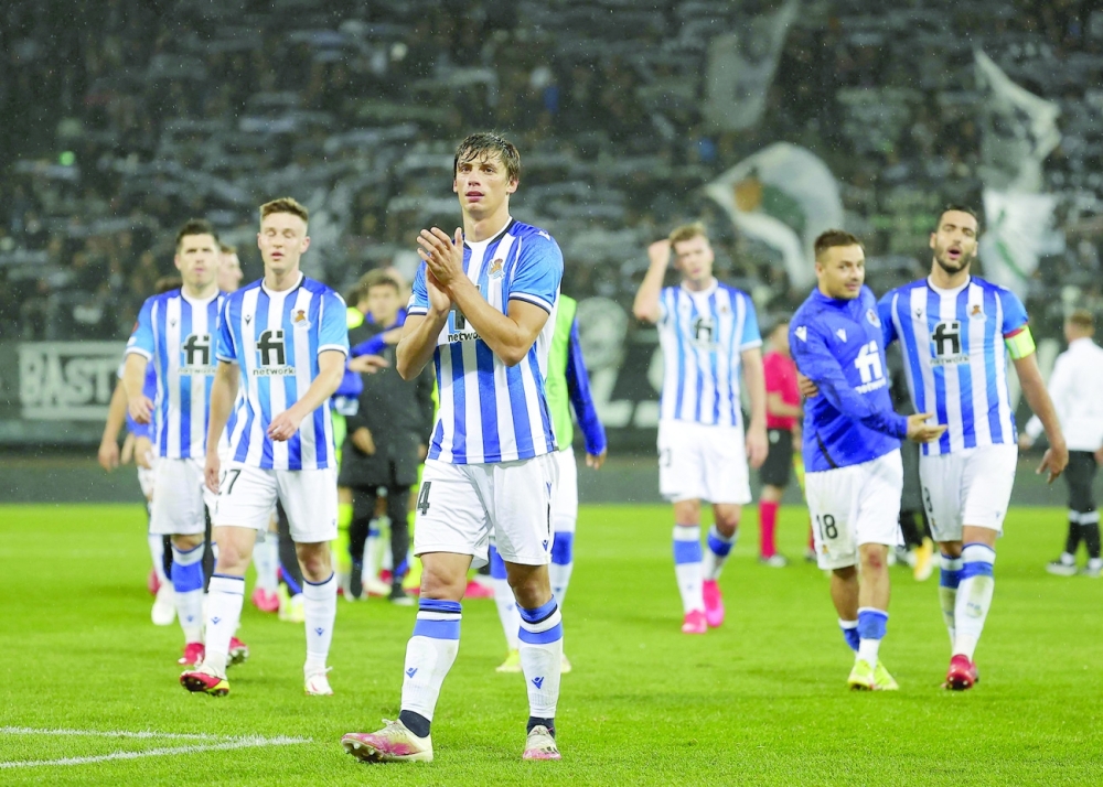 Real Sociedad's plazers celebrate after the UEFA Europa League group B match. -- AFP