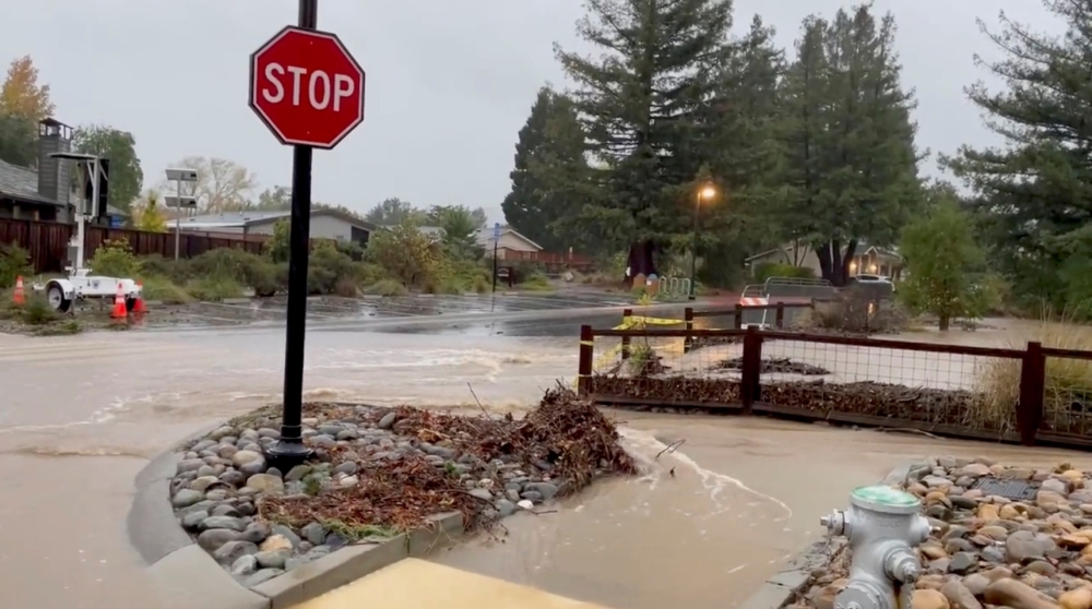 Flood waters run through Mulberry street in Yountville, California. - Reuters