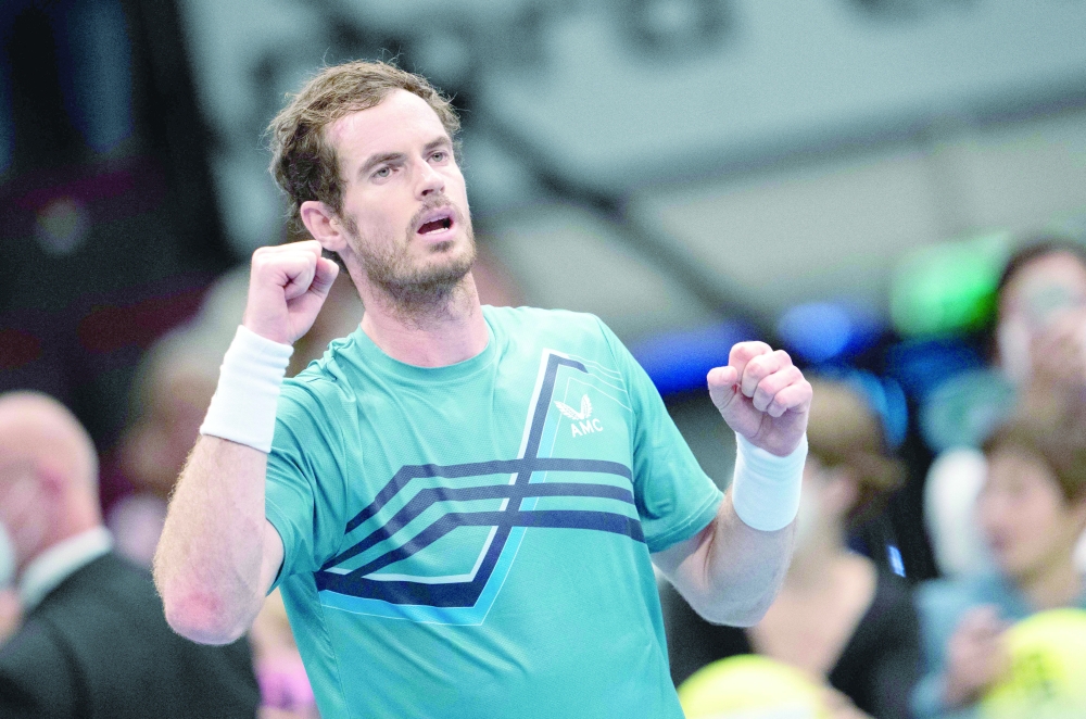 Andy Murray celebrates after winning against Poland's Hubert Hurkacz (not in picture) during the men's singles match at the Erste Bank Open. -- AFP