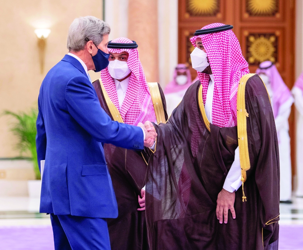 US Climate Adviser John Kerry with Saudi Crown Prince Mohammed bin Salman at the Summit of the Green Middle East Initiative in Riyadh, Saudi Arabia. - Reuters