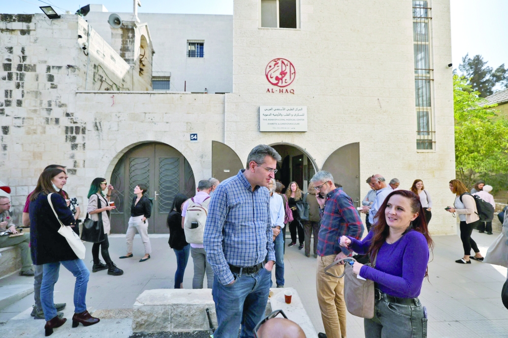 Israeli left wing activists gather with Palestinian activists at the Al Haq Foundation in Ramallah to denounce Israel's decision. - AFP