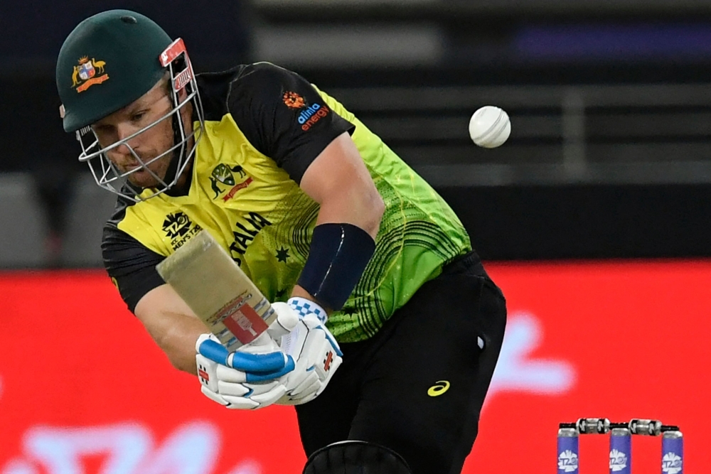 Aaron Finch plays a shot during the match between Australia and Sri Lanka at the Dubai International Cricket Stadium in Dubai on Thursday. -- AFP