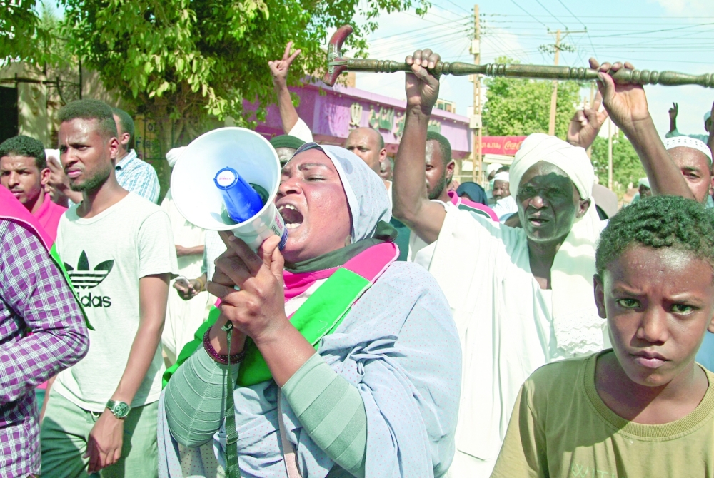 Supporters of the Umma Party, Sudan's largest political party, chant slogans during a protest against a military coup that overthrew the transition to civilian rule, on Friday in Khartoum's twin city of Omdurman. - AFP 