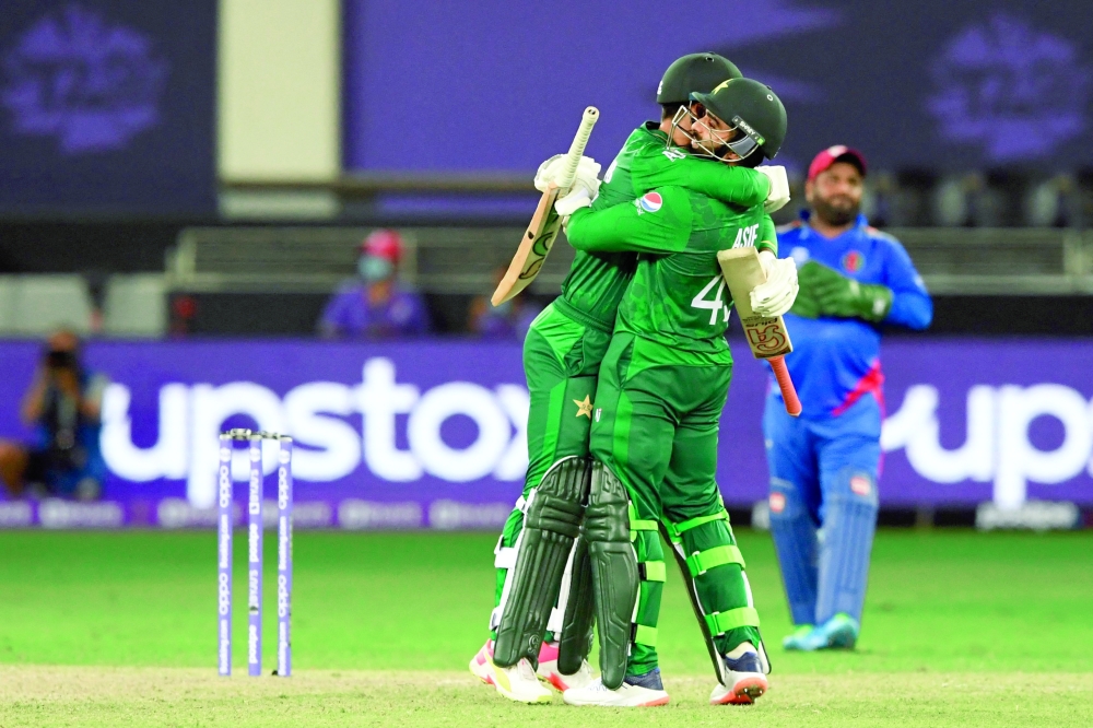 Pakistan's Shadab Khan (L) and Asif Ali celebrate their win. -- AFP