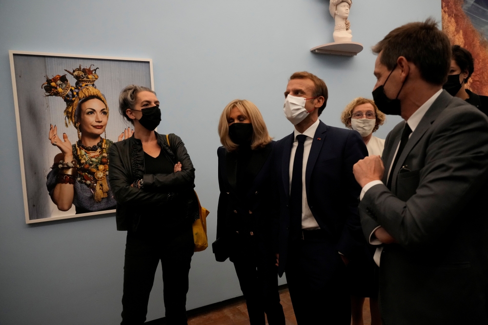 Emmanuel Macron, accompanied by his wife Brigitte Macron