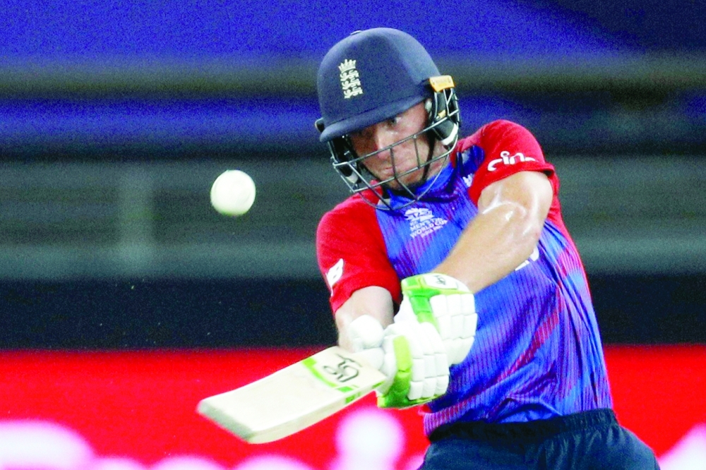 England's Jos Buttler hits a four. -- Reuters
