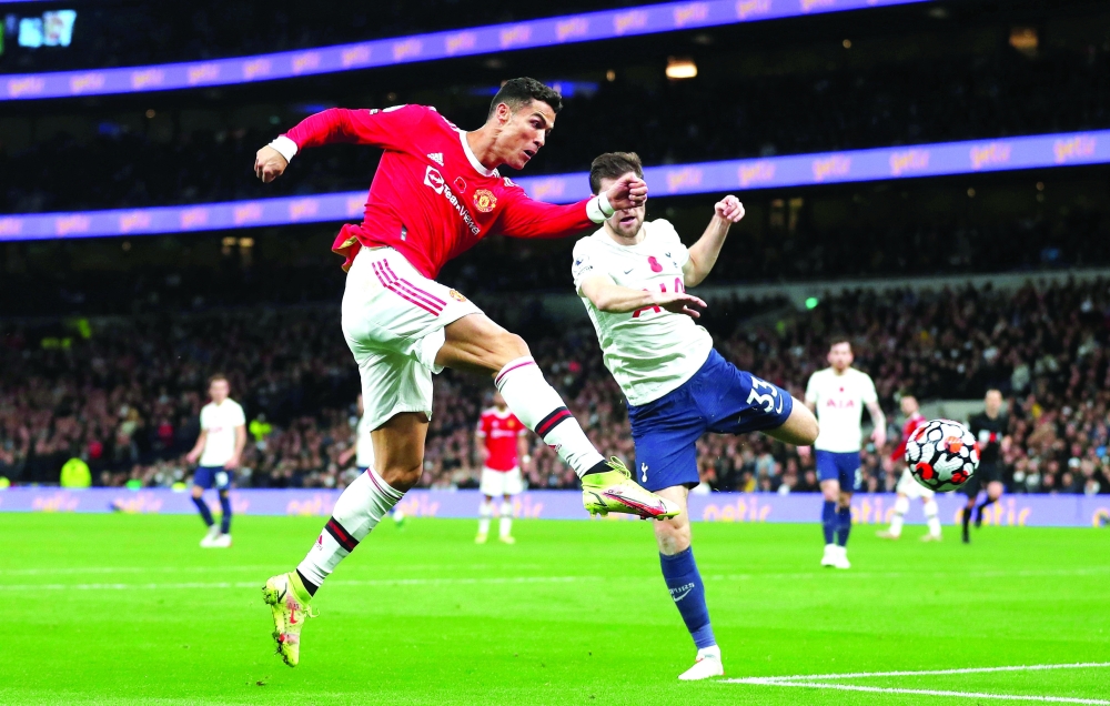 Manchester United's Cristiano Ronaldo scores their first goal. -- Reuters