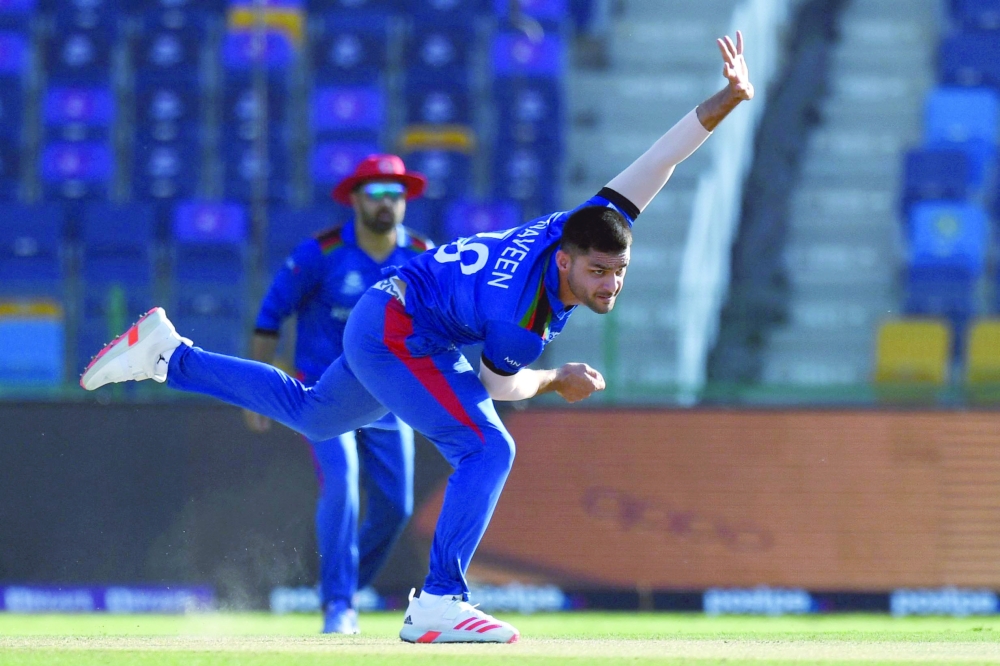 Afghanistan's Naveen-ul-Haq bowls during the match. -- AFP