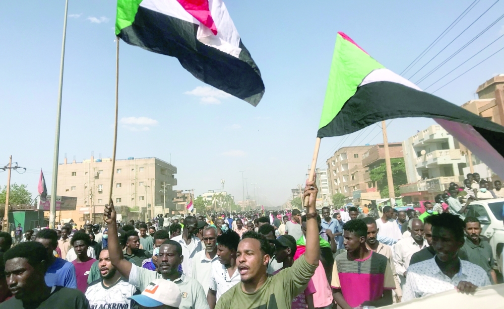 Protesters chant slogans as they march on the streets of capital Khartoum, Sudan. - Reuters