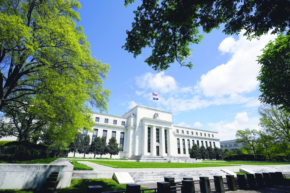 The Federal Reserve building is set against a blue sky in Washington. - Reuters
