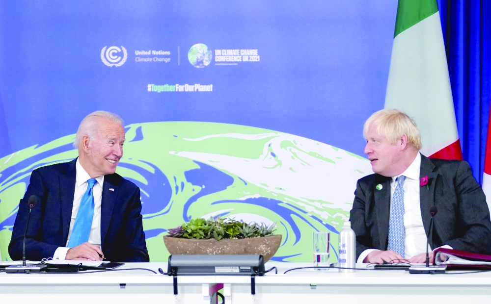 US President Joe Biden and Britain's Prime Minister Boris Johnson participate in a meeting on the Build Back Better World (B3W) initiative in Glasgow. - Reuters
